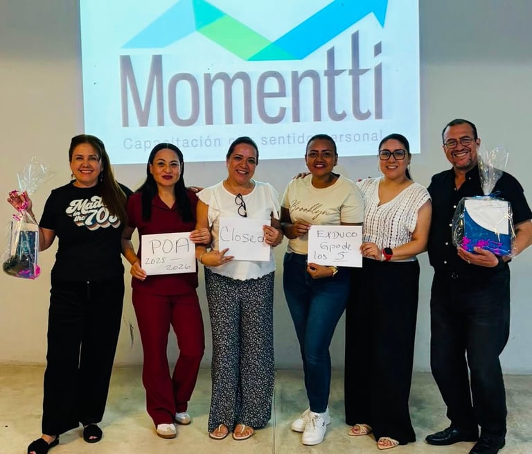 Six people standing in a line holding awards and certificates in front of a Momentti logo backdrop